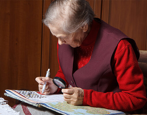 Senior woman solving a crossword puzzle